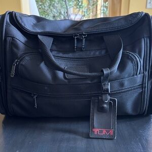 Tumi Black Men's Duffel with Red Logo Luggage Tag